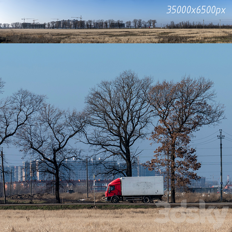 COUNTRYSIDE PANORAMA OF NEW BUILDINGS AND TREES 