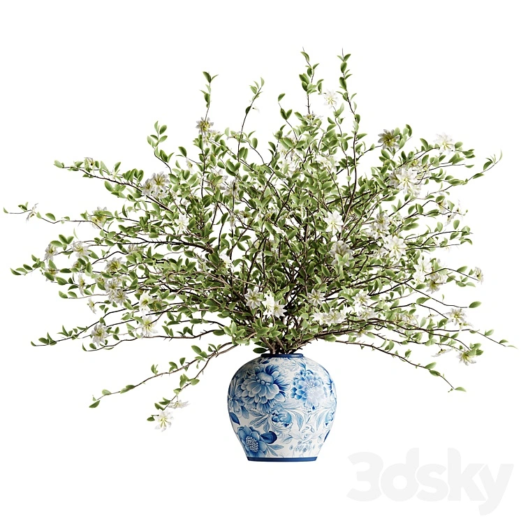 A bouquet of tree branches inserted into a celadon ceramic pot 